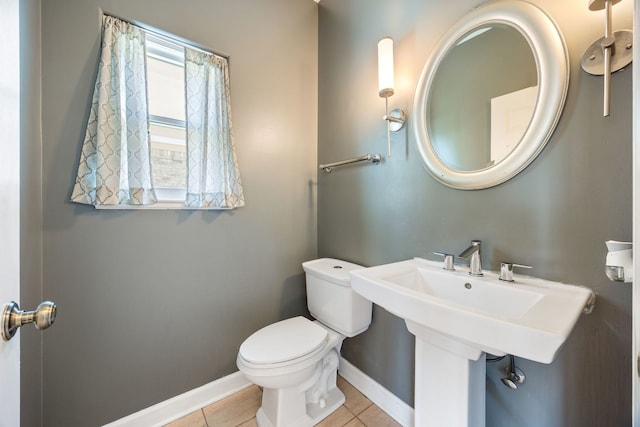 9231 N Natchez Ave, Morton Grove, IL 60053 - bathroom featuring baseboards, toilet, and tile patterned flooring