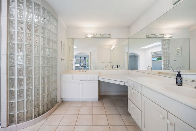 9231 N Natchez Ave, Morton Grove, IL 60053 - bathroom with tile patterned floors, vanity, and a walk in shower