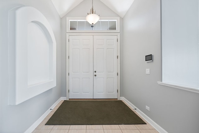 9231 N Natchez Ave, Morton Grove, IL 60053 - entrance foyer with baseboards, vaulted ceiling, and tile patterned flooring