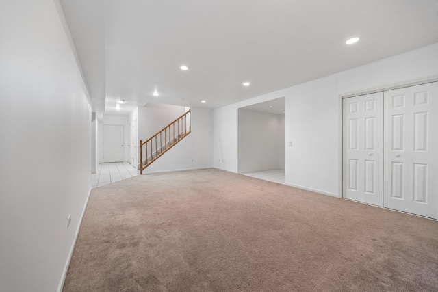 9231 N Natchez Ave, Morton Grove, IL 60053 - below grade area featuring light colored carpet, stairs, recessed lighting, and baseboards