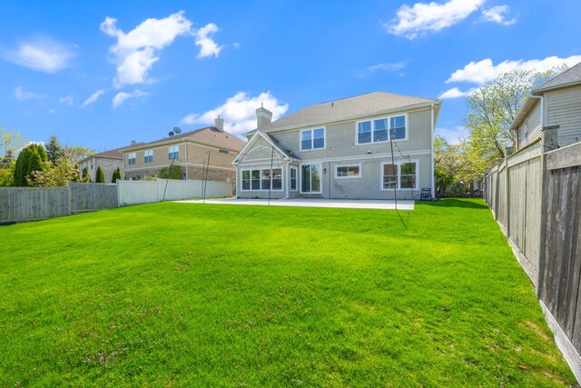 9231 N Natchez Ave, Morton Grove, IL 60053 - rear view of property with a patio area, a chimney, and stucco siding