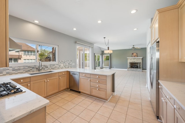 9231 N Natchez Ave, Morton Grove, IL 60053 - kitchen featuring a sink, stainless steel appliances, light brown cabinets, open floor plan, and recessed lighting