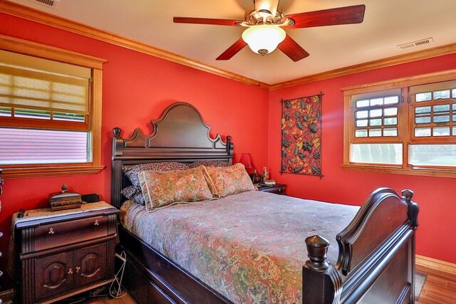 140 Princeton St, Hoffman Estates, IL 60169 - bedroom with wood finished floors, crown molding, and a ceiling fan