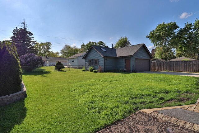 140 Princeton St, Hoffman Estates, IL 60169 - view of yard with asphalt driveway and a garage
