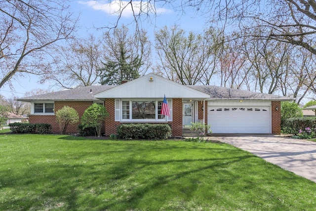 745 Konen Ave, Aurora, IL 60505 - view of front of property featuring an attached garage, concrete driveway, a front lawn, and brick siding