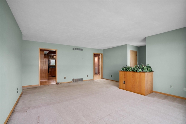 745 Konen Ave, Aurora, IL 60505 - unfurnished room with baseboards and light carpet