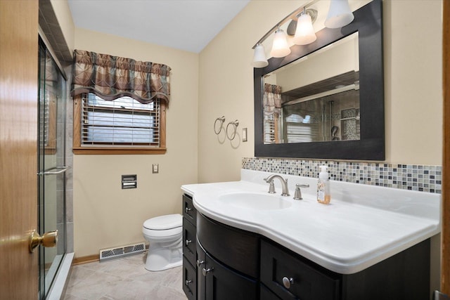 745 Konen Ave, Aurora, IL 60505 - bathroom with a stall shower, vanity, toilet, and baseboards