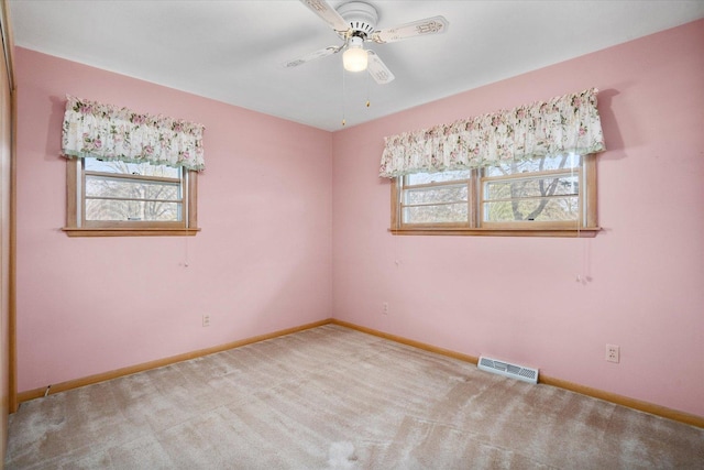 745 Konen Ave, Aurora, IL 60505 - empty room featuring a ceiling fan, carpet floors, and baseboards