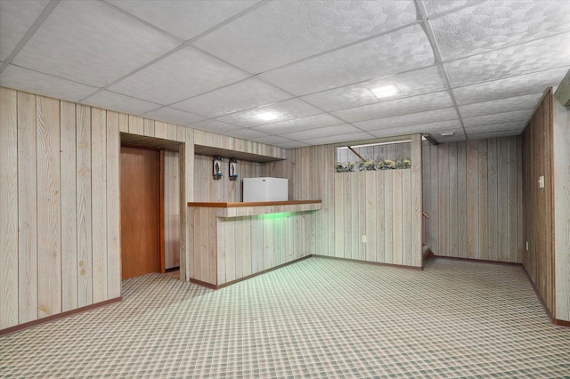 745 Konen Ave, Aurora, IL 60505 - kitchen featuring wooden walls, baseboards, a paneled ceiling, and carpet