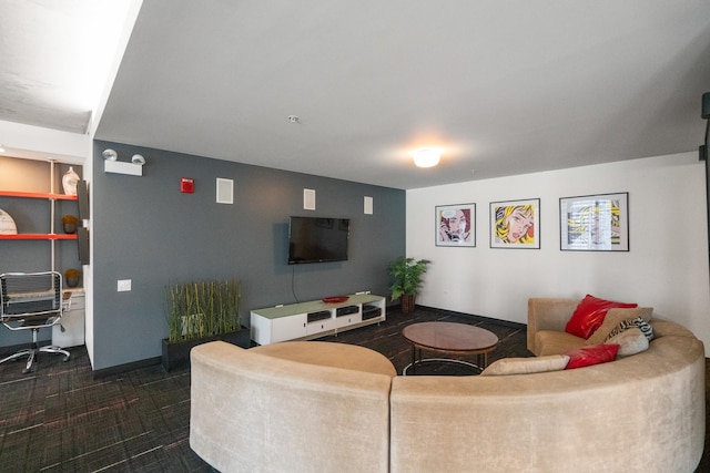 living room with dark carpet