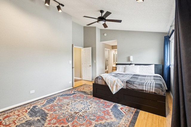 992 Hidden Lake Dr, Buffalo Grove, IL 60089 - bedroom with a textured ceiling, baseboards, a ceiling fan, and high vaulted ceiling