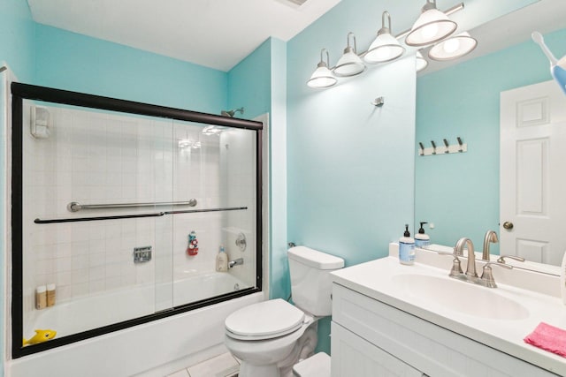 992 Hidden Lake Dr, Buffalo Grove, IL 60089 - bathroom featuring toilet, vanity, and enclosed tub / shower combo