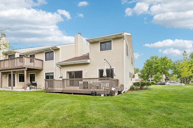 992 Hidden Lake Dr, Buffalo Grove, IL 60089 - rear view of house with a yard, a wooden deck, a patio, and a chimney