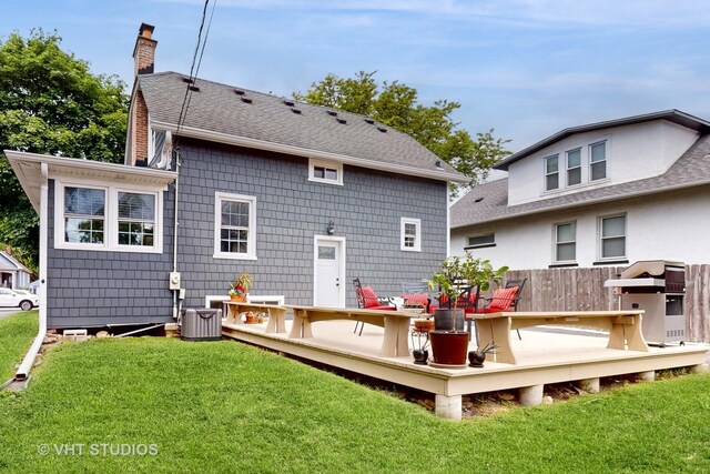 4627 S Wolf Rd, Western Springs, IL 60558 - rear view of house featuring a deck, a yard, a chimney, and central AC unit