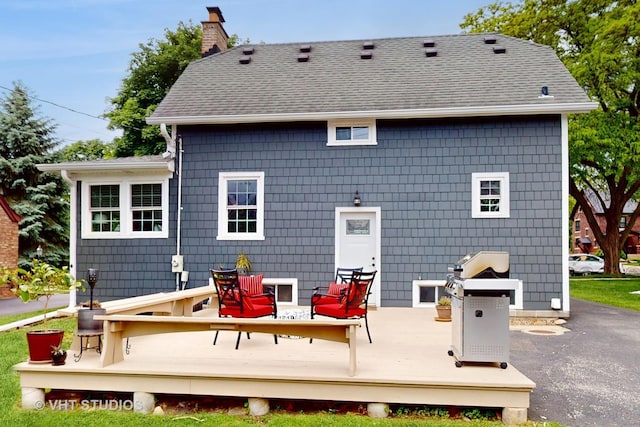 4627 S Wolf Rd, Western Springs, IL 60558 - back of house with a wooden deck, a chimney, and roof with shingles