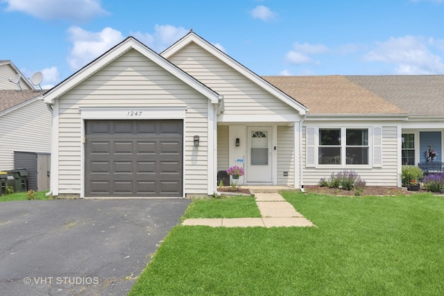 1247 Trinity Dr, Carol Stream, IL 60188 - ranch-style house featuring asphalt driveway, a garage, a front lawn, and a shingled roof