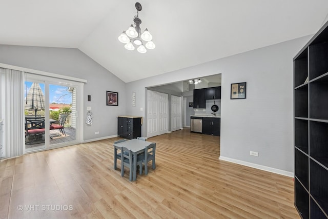 1247 Trinity Dr, Carol Stream, IL 60188 - living room featuring light wood-style flooring, a chandelier, and high vaulted ceiling