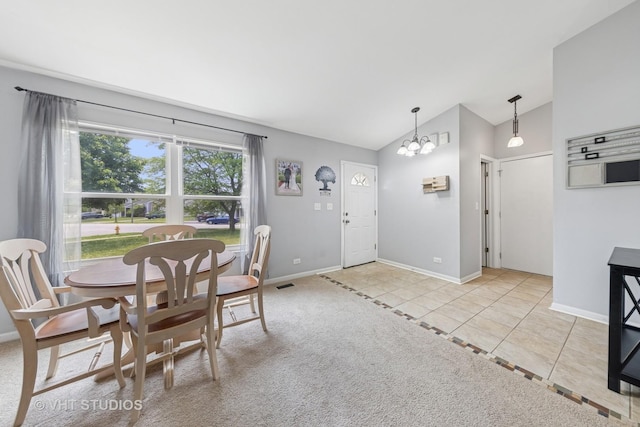 1247 Trinity Dr, Carol Stream, IL 60188 - tiled dining area with vaulted ceiling and a chandelier