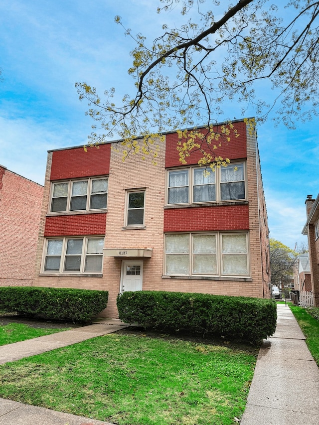 8137 Keating Ave, Skokie, IL 60076 - view of front facade featuring brick siding and a front yard