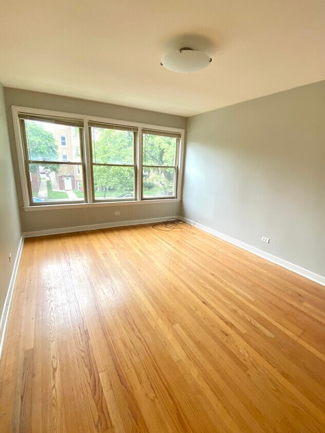 8137 Keating Ave, Skokie, IL 60076 - spare room with light wood-style flooring and baseboards