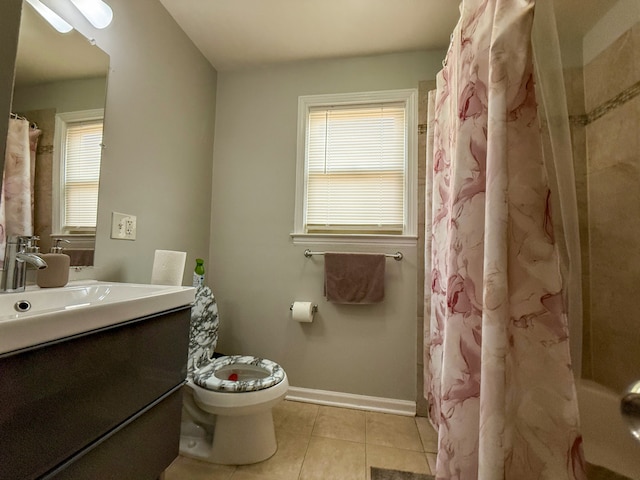 8137 Keating Ave, Skokie, IL 60076 - bathroom with tile patterned flooring, plenty of natural light, vanity, and baseboards