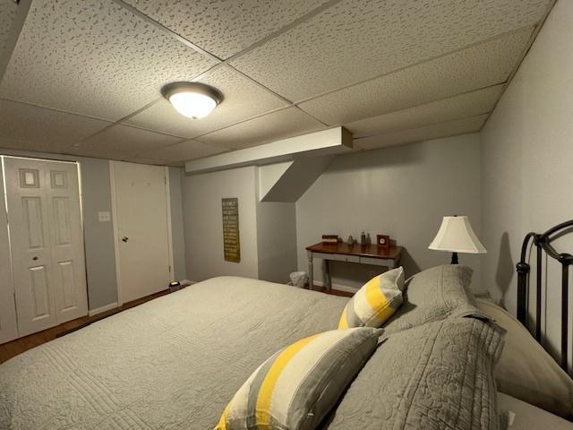 1521 E Stonehenge Dr Unit 1521, Sycamore, IL 60178 - bedroom with a drop ceiling and wood finished floors