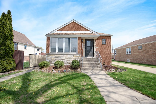 5533 S Menard Ave, Chicago, IL 60638 - bungalow-style home with brick siding and stone siding