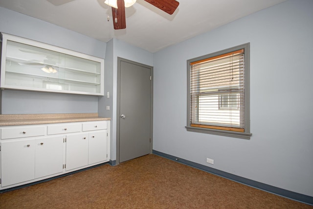 5533 S Menard Ave, Chicago, IL 60638 - bar featuring dark colored carpet, a ceiling fan, and baseboards