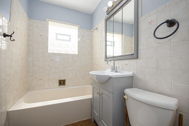 5533 S Menard Ave, Chicago, IL 60638 - full bathroom featuring tile walls, toilet, shower / bath combination, and vanity