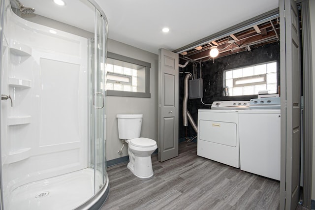 5533 S Menard Ave, Chicago, IL 60638 - bathroom featuring washing machine and clothes dryer, a shower stall, wood finished floors, toilet, and recessed lighting