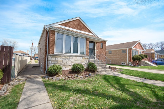 5533 S Menard Ave, Chicago, IL 60638 - bungalow featuring stone siding, brick siding, and entry steps