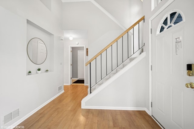 36164 N Bridlewood Ave, Gurnee, IL 60031 - foyer entrance featuring a towering ceiling, stairs, wood finished floors, and baseboards