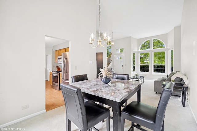 36164 N Bridlewood Ave, Gurnee, IL 60031 - dining area with light colored carpet, a chandelier, and baseboards