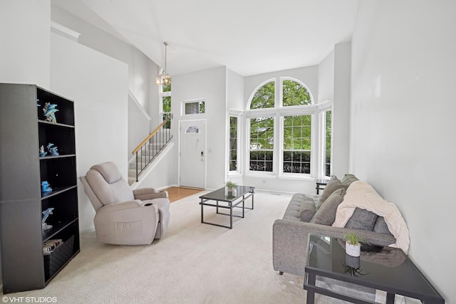 36164 N Bridlewood Ave, Gurnee, IL 60031 - living room featuring stairs, carpet flooring, and a towering ceiling
