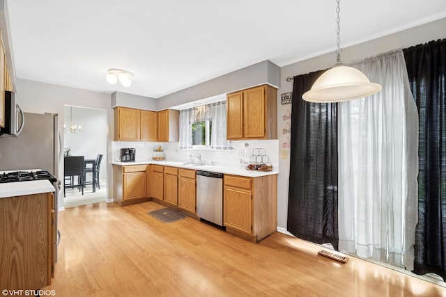 36164 N Bridlewood Ave, Gurnee, IL 60031 - kitchen with appliances with stainless steel finishes, light wood-style floors, a sink, and light countertops