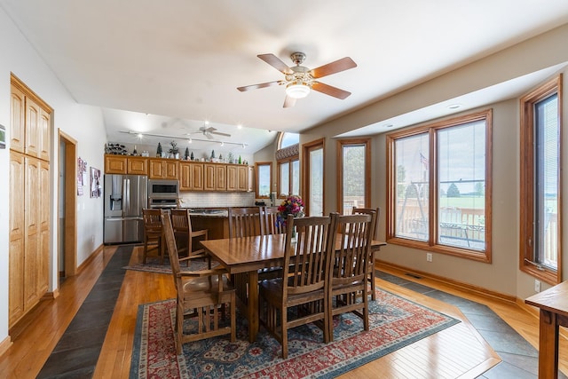 56 Huntsman Ln, Plano, IL 60545 - dining room with hardwood / wood-style floors, ceiling fan, plenty of natural light, and baseboards