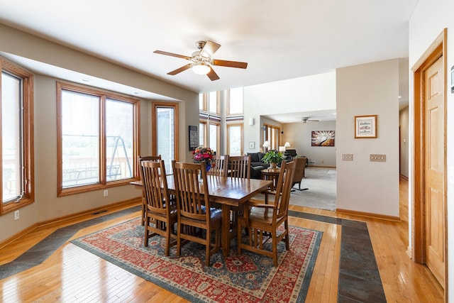 56 Huntsman Ln, Plano, IL 60545 - dining room featuring ceiling fan, light wood finished floors, and baseboards