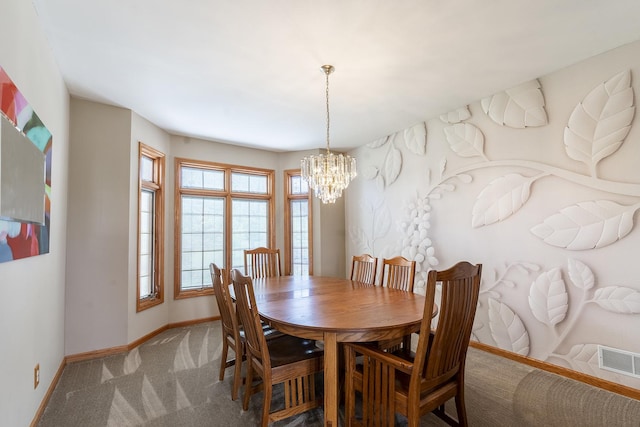 56 Huntsman Ln, Plano, IL 60545 - dining area featuring baseboards, carpet floors, and a chandelier