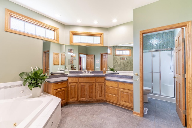 56 Huntsman Ln, Plano, IL 60545 - full bath with a shower stall, vanity, a whirlpool tub, toilet, and recessed lighting