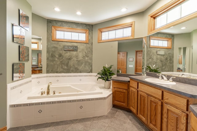 56 Huntsman Ln, Plano, IL 60545 - full bathroom featuring a whirlpool tub, vanity, plenty of natural light, and recessed lighting