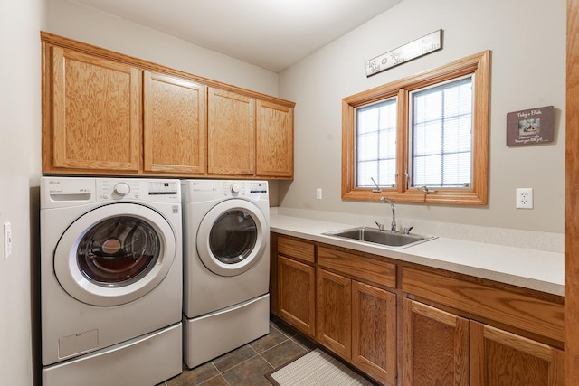 56 Huntsman Ln, Plano, IL 60545 - laundry room featuring cabinet space, separate washer and dryer, and dark tile patterned floors