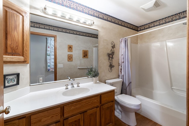 56 Huntsman Ln, Plano, IL 60545 - full bathroom with toilet, vanity, shower / bath combo with shower curtain, and wood finished floors