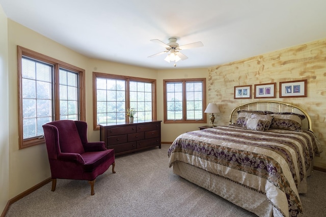 56 Huntsman Ln, Plano, IL 60545 - carpeted bedroom with baseboards and a ceiling fan