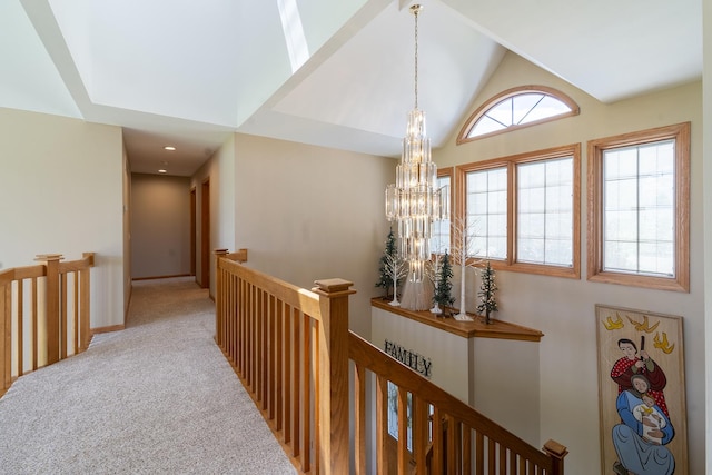 56 Huntsman Ln, Plano, IL 60545 - hall featuring an upstairs landing, a chandelier, high vaulted ceiling, and carpet