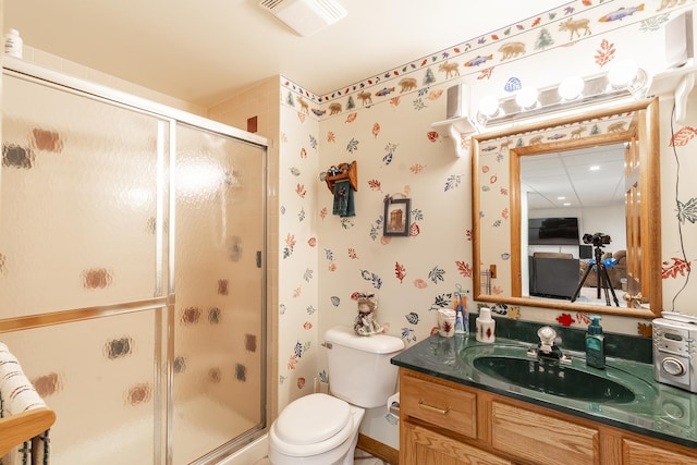 56 Huntsman Ln, Plano, IL 60545 - bathroom featuring a stall shower, vanity, toilet, and wallpapered walls