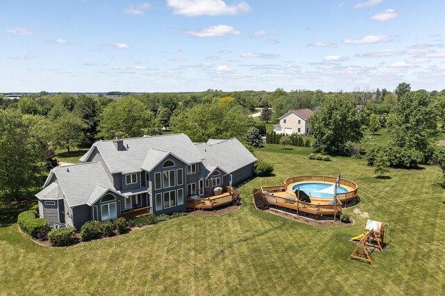 56 Huntsman Ln, Plano, IL 60545 - aerial view of property and surrounding area with a heavily wooded area