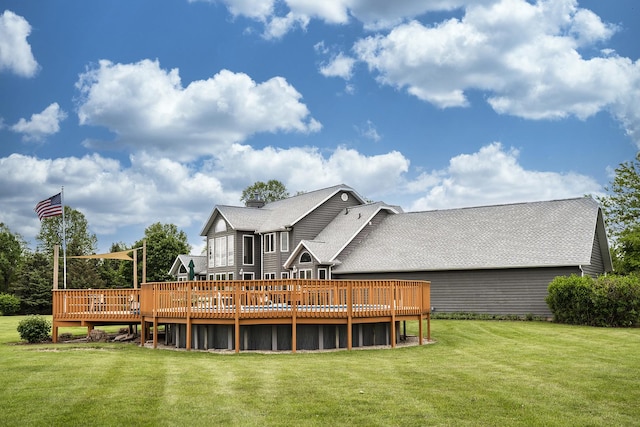 56 Huntsman Ln, Plano, IL 60545 - rear view of property with a wooden deck and a yard