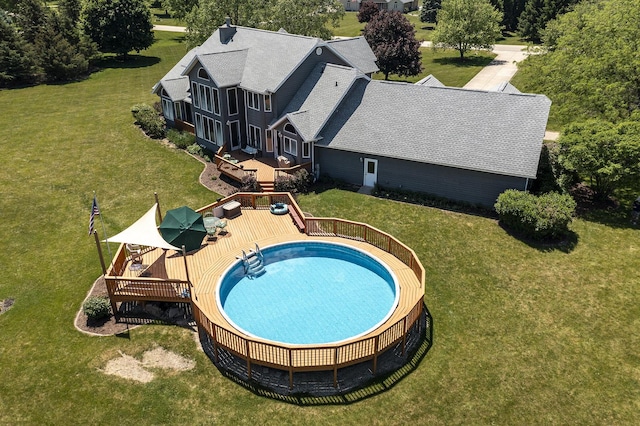 56 Huntsman Ln, Plano, IL 60545 - view of swimming pool featuring a deck and a yard