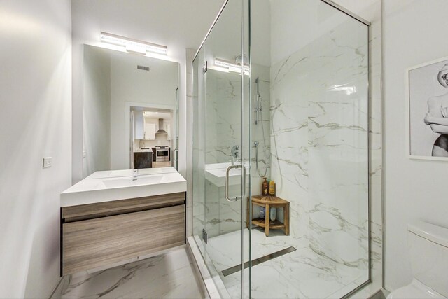 1300 N Artesian Ave Unit F, Chicago, IL 60622 - full bathroom with a marble finish shower, marble look tiles, vanity, and toilet