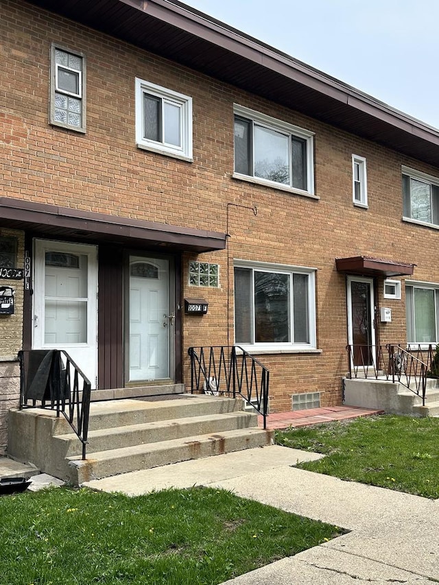10071 Frontage Rd Unit F, Skokie, IL 60077 - rear view of house featuring brick siding